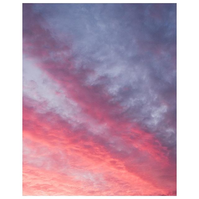 A vibrant sunset paints the sky with soft pinks and purples, creating a serene and dreamy atmosphere.