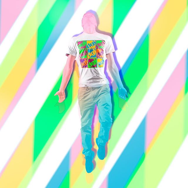 A man in a graphic tee floats against a colorful background, perfect for vibrant social media or advertising.