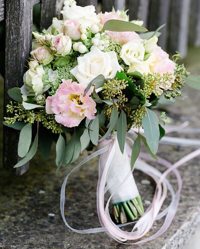 A beautiful wedding bouquet with roses and soft ribbons, perfect for romantic celebrations and elegant floral design.