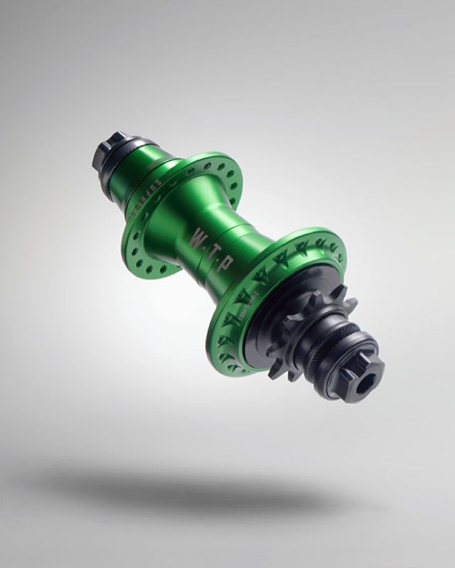 A close-up shot of a green WTP bicycle hub, highlighting its design and features for cycling enthusiasts.