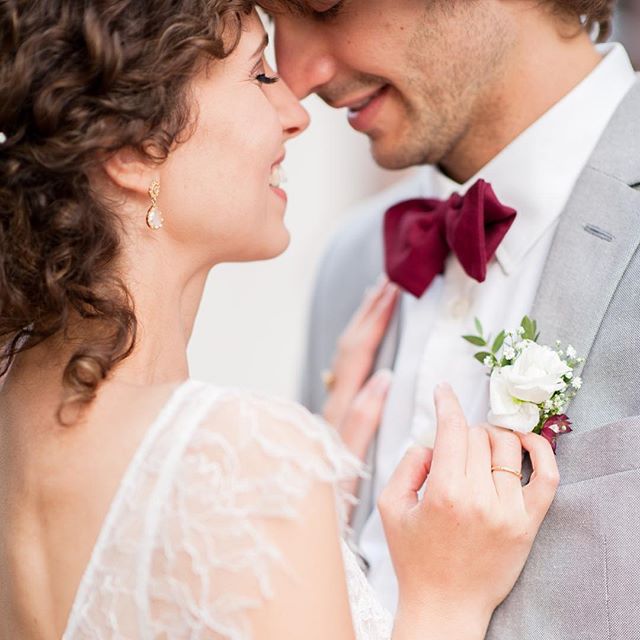 A loving couple shares an intimate moment on their wedding day, radiating happiness and affection.