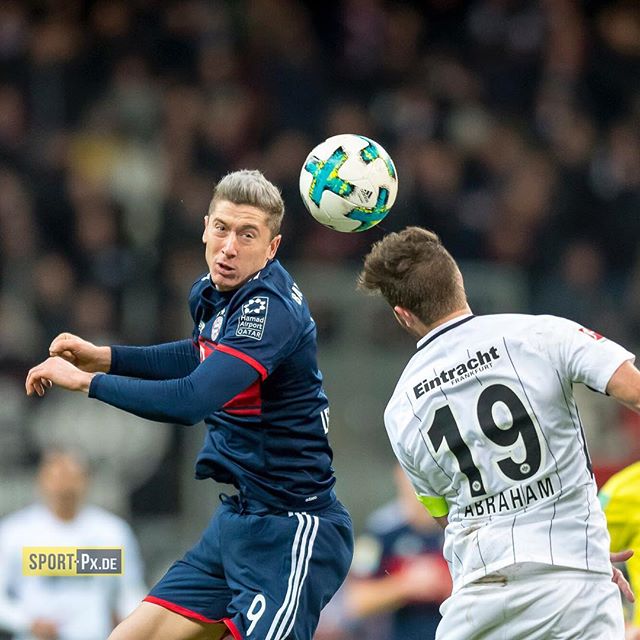 Action shot of soccer players Robert Lewandowski and Marco Abraham during a game. 
