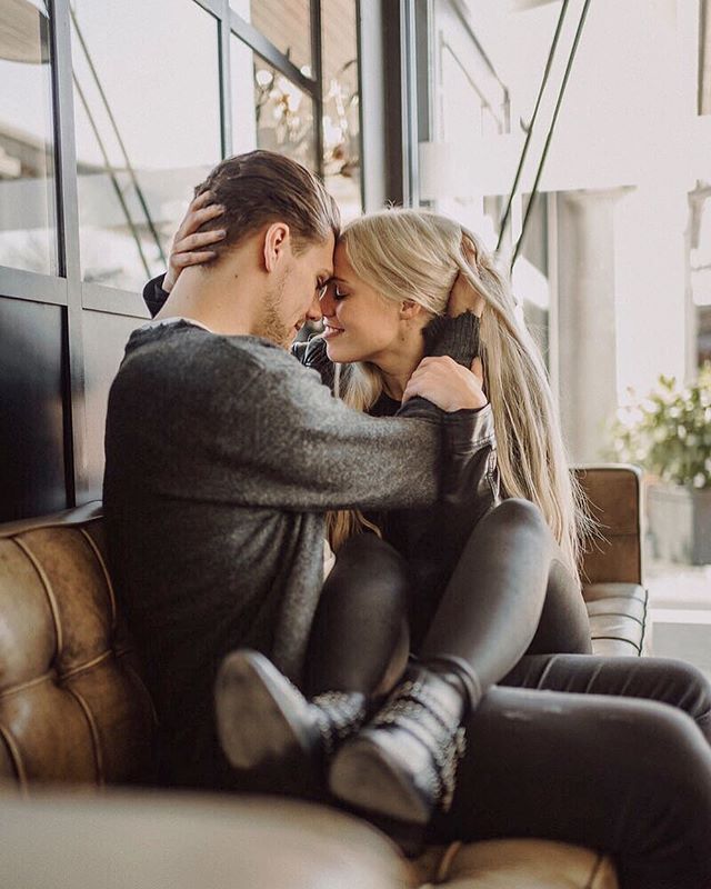 A loving couple shares an intimate moment indoors. Perfect for lifestyle, romance, and relationship content.