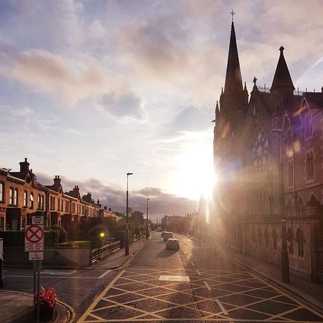 A street view with a church building on a sunny day captures the essence of urban architecture and travel.