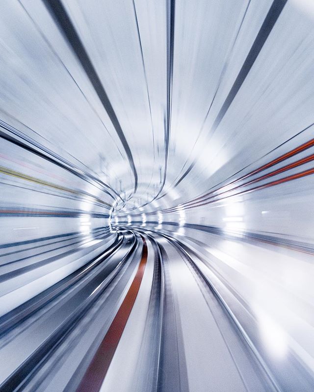 Abstract view through a subway tunnel showing motion blur, ideal for transportation or infrastructure concepts.