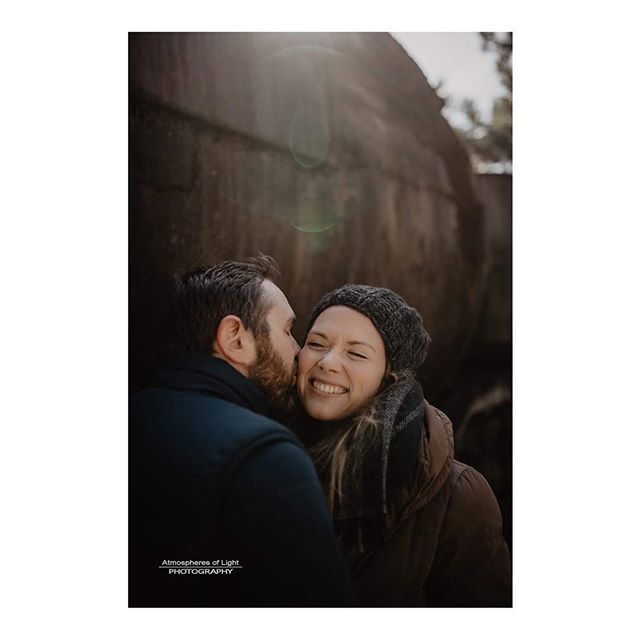 A happy couple embraces outdoors in an affectionate moment, bathed in soft light. Celebrating love, autumn, and outdoor lifestyles.