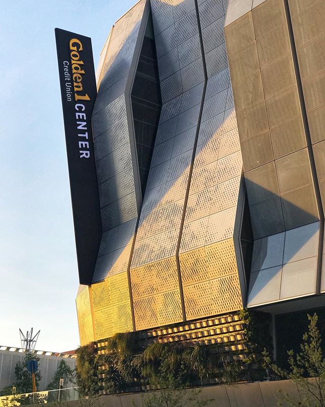 The Golden 1 Center building features modern architecture with a geometric facade and prominent branding signage.
