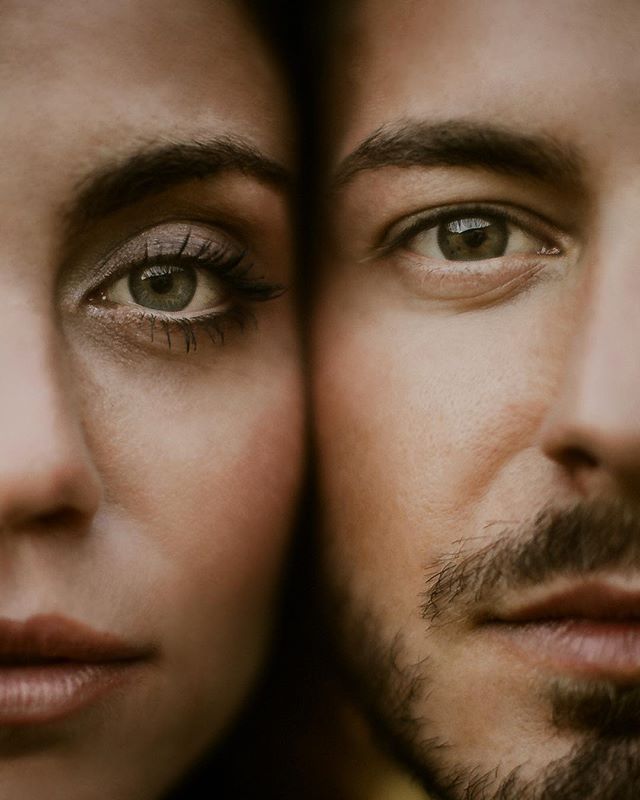A close-up portrait of a man and woman, faces touching, showcasing an intimate and tender connection.