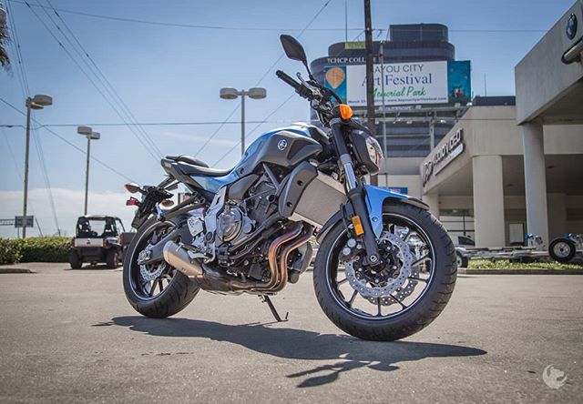A Yamaha MT-07 motorcycle parked on a city street is ready for a ride.