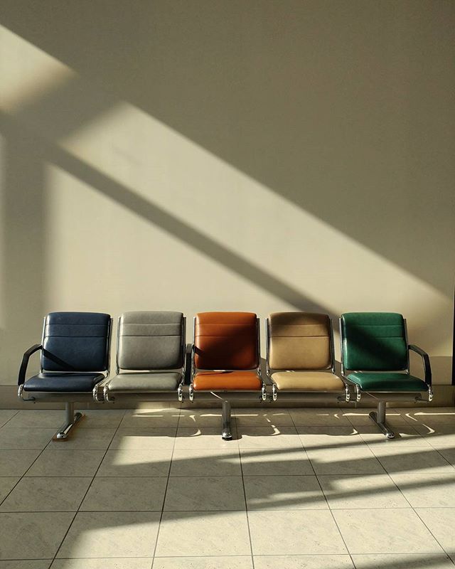 A row of empty chairs in a waiting area basks in the soft light, creating a sense of calm and anticipation.