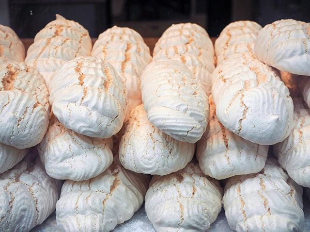 A close-up shot of a pile of delicious meringues, perfect for bakery or dessert-themed content.