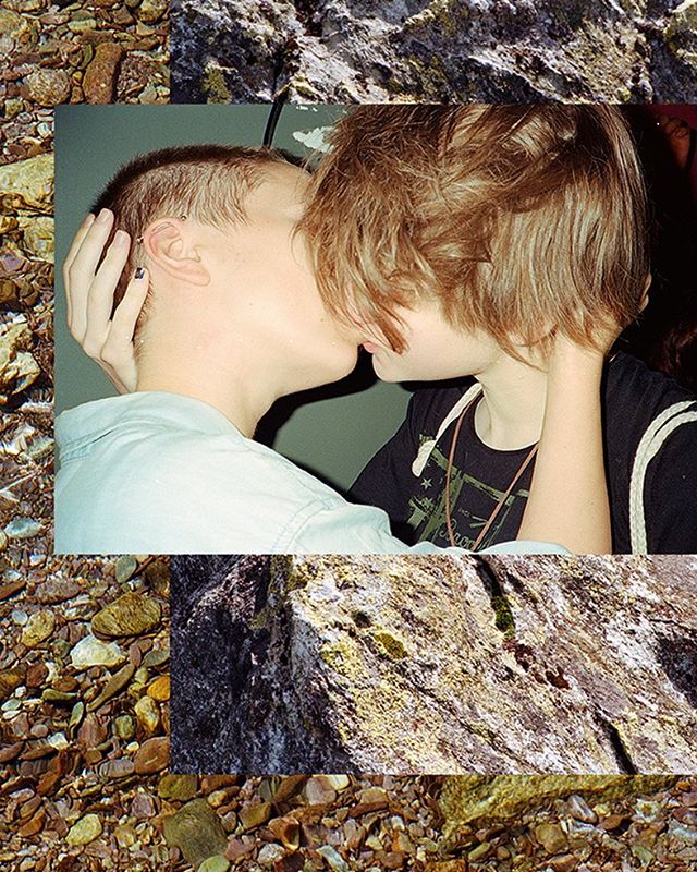A vintage-style photo features two people kissing in a warm and intimate moment, perfect for relationship or LGBTQ+ marketing.