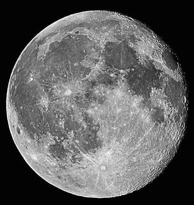 Detailed grayscale image of the moon showcasing its cratered surface against a black sky.