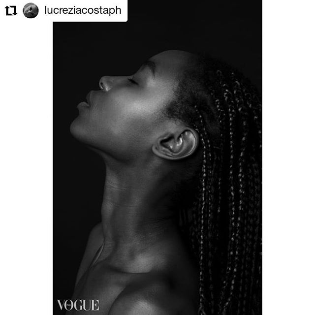 A serene black and white portrait of a woman with her eyes closed, showcasing an editorial aesthetic.