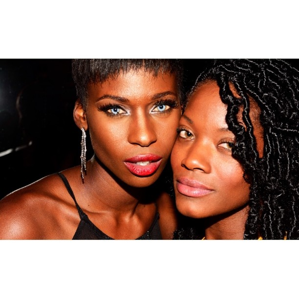 Two beautiful African American women pose closely for a striking beauty portrait.