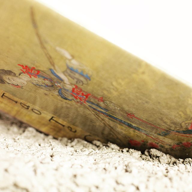 Vintage illustration of an ancient figure on aged material, capturing history and art.