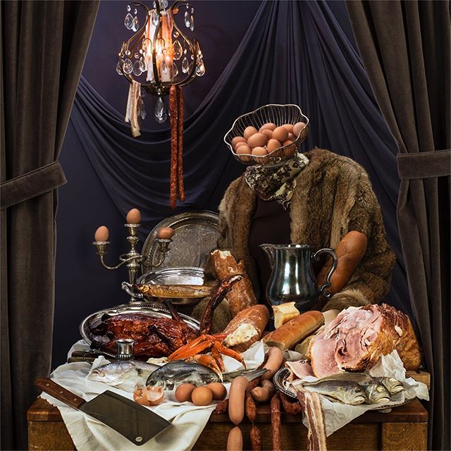 A surreal still life featuring a lavish display of meats, fish, eggs, and other culinary elements in a vintage setting.