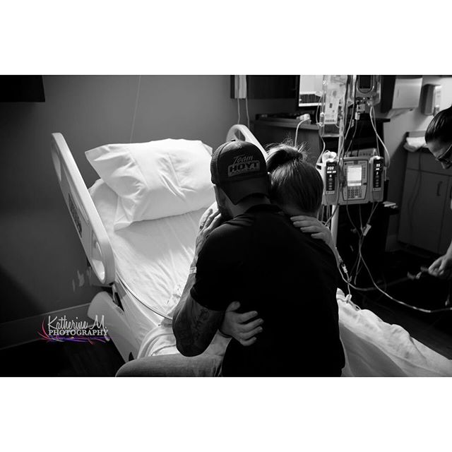 A couple shares an emotional embrace in a hospital room, offering comfort and love during a challenging time.