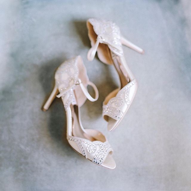 Elegant wedding shoes with embellishments, perfect for a bridal fashion campaign or special occasion advertisement.