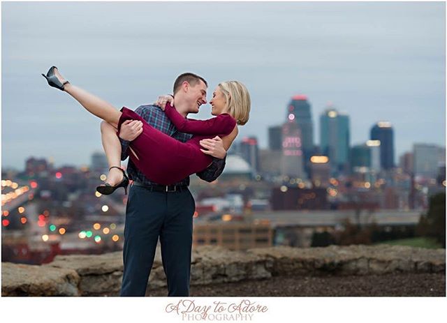 A happy couple embraces in a romantic pose with a beautiful city skyline, perfect for social media or advertising.