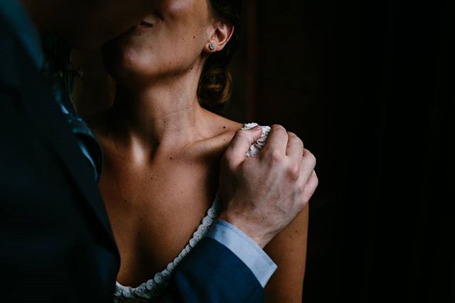 An intimate moment captured of a bride and groom in a tender embrace on their wedding day.