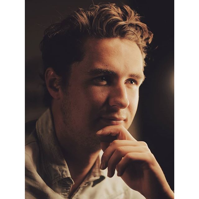 Contemplative man in soft light, a portrait for social media or advertising.