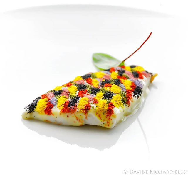 A vibrant, modern dish with colorful toppings, perfect for fine dining and gourmet food experiences.