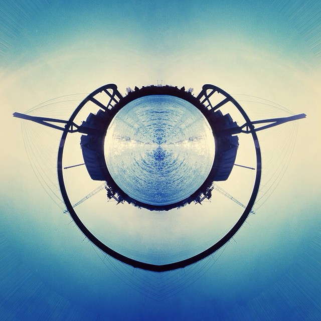 A captivating abstract image of a city's bridge and waterscape, creating a tranquil and surreal atmosphere.