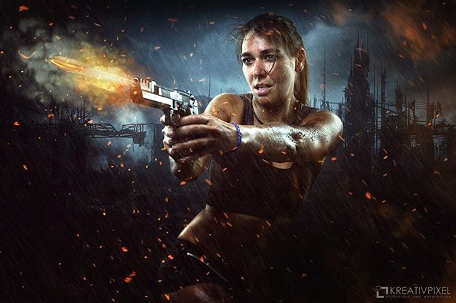 A woman fires a handgun in a rainy, dark cityscape, creating a dramatic action scene.